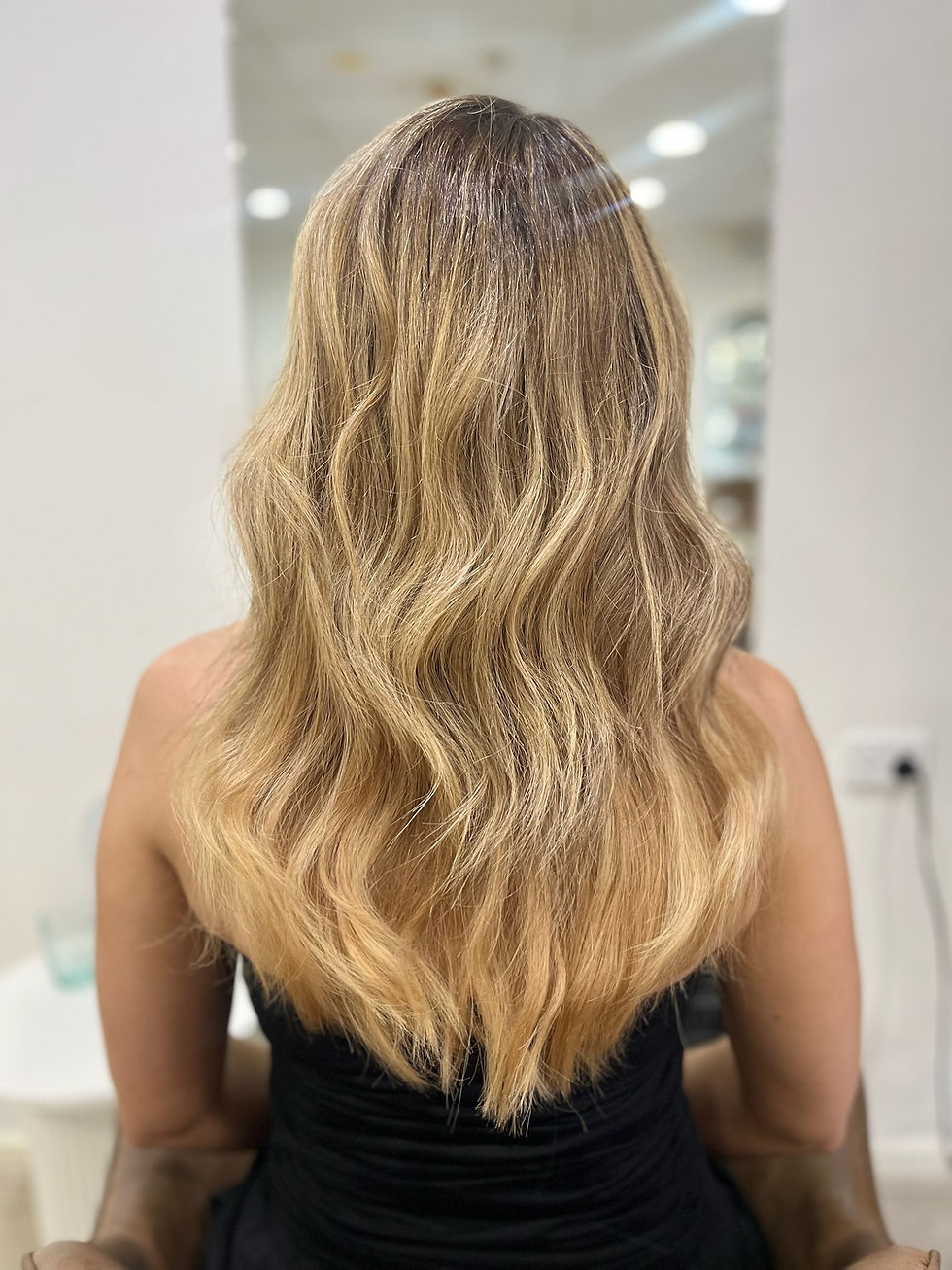 Weft hair extensions in Altona adding natural fullness and thickness to fine hair at Renew Hair