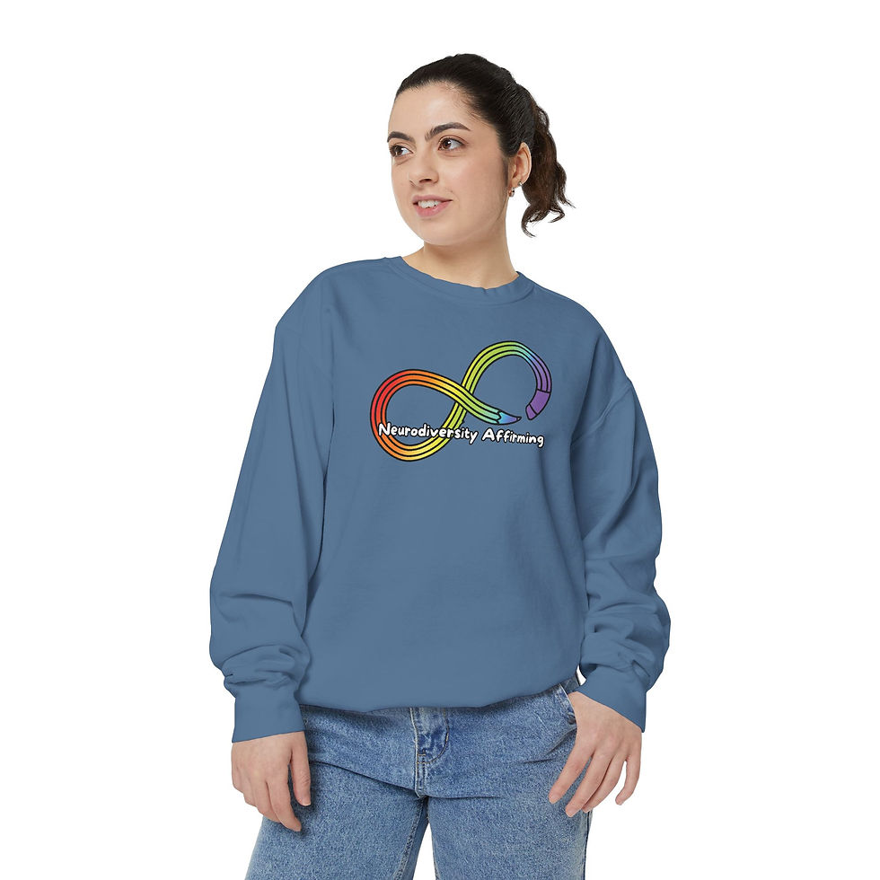 A blue jean colored crewneck with a rainbow colored pencil in the shape of an infinity symbol. Text says: Neurodiversity Affirming