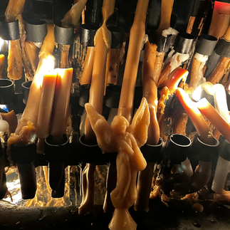 Burning candles at the Fatima Sanctuary fulfilling a prayer intention