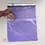 Thumbnail: Hand holding open a purple poly mailer with POD adhesive strip, showing its size and flexibility