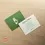 Thumbnail: Two square cards for "Bump & Beyond" on a wooden surface. One card has the company logo in green. The other card has text de