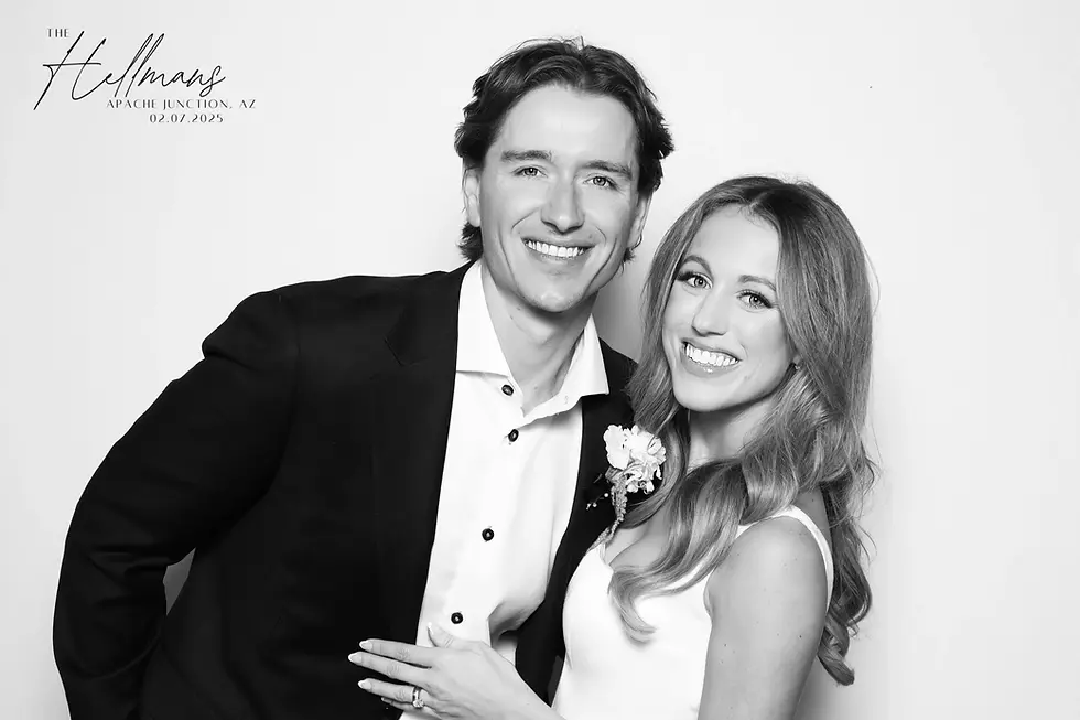 Smiling bride and groom in a black and white wedding photo booth portrait in Coeur d'Alene