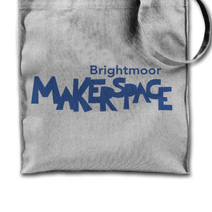 The primary Brightmoor Makerspace wordmark is centered on a cloth tote bag.