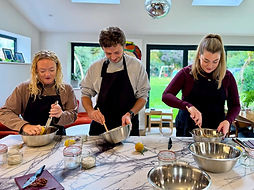 Students in cookery class mixing food
