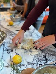Student kneading dough