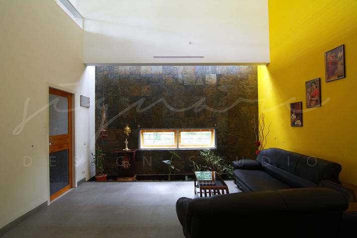 Residence in Kerala, Kerala Architecture, Vernacular Architecture, Traditional Architecture, Double height space, Stone Cladding, Living area, skylight, Kottayam, Architects Bangalore, Traditional Indian Homes, Interior Design Style, Best Indian Architects, architecture Bangalore, Interior design Trends, Modern Interior Design, Modern House Design, Modern Kerala house design, Top Architectural Firms in Bangalore, Courtyard house Kerala, Vernacular Architecture Firm in Bangalore, Architects in North Bangalore, Minimalistic house, Top Interior designers in India, Top Traditional Architects in India, Architectural Design services in Bangalore.