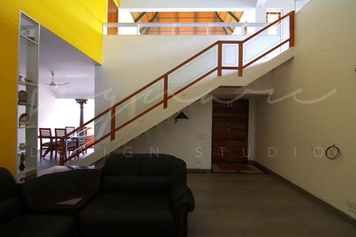 Residence in Kerala, Kerala Architecture, Vernacular Architecture, sloped roof, Traditional Architecture, Double height space, wooden staircase, single flight staircase, Living area, Kottayam, Architects Bangalore, Traditional Indian Homes, Interior Design Style, Best Indian Architects, architecture Bangalore, Interior design Trends, Modern Interior Design, Modern House Design, Modern Kerala house design, Top Architectural Firms in Bangalore, Courtyard house Kerala, Vernacular Architecture Firm in Bangalore, Architects in North Bangalore, Minimalistic house, Top Interior designers in India, Top Traditional Architects in India, Architectural Design services in Bangalore.