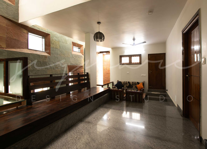 Residence in Bangalore, Interior Design, Kerala Traditional Architecture, wooden furniture, wooden staircase, Informal living, Skylight, Double height, Natural light, Nagavara, Architects Bangalore, Traditional Indian Homes, Interior Design Style, Best Indian Architects, architecture Bangalore, Interior design Trends, Modern Interior Design, Modern House Design, Modern Kerala house design, Top Architectural Firms in Bangalore, Architects in North Bangalore, Minimalistic house, Top Interior designers in India, Top Traditional Architects in India, Architectural Design services in Bangalore.