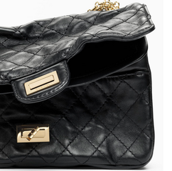 Chanel 2.55 distressed handbag detail shot