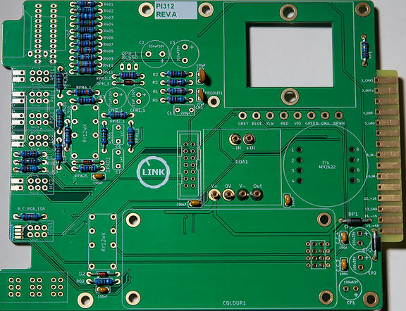 PCB assembly showing IC sockets and low profile ceramic capacitors