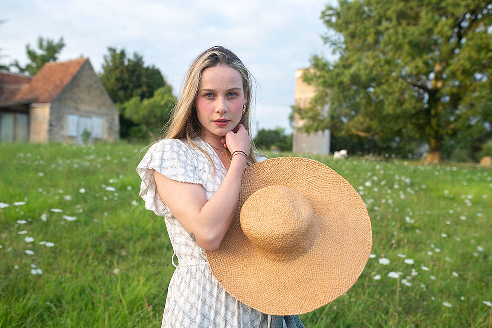 girl holding a sun hat