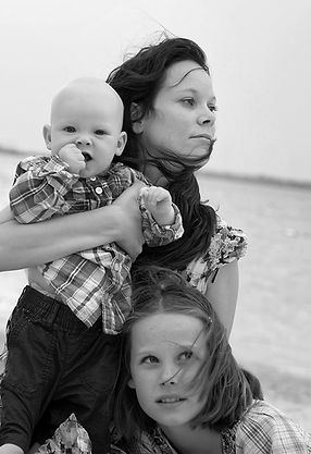 cara hodge, dublin newborn and baby photographer with her own baby son and daughter