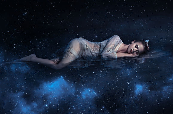 Girl sleeps in space among stars night sky
