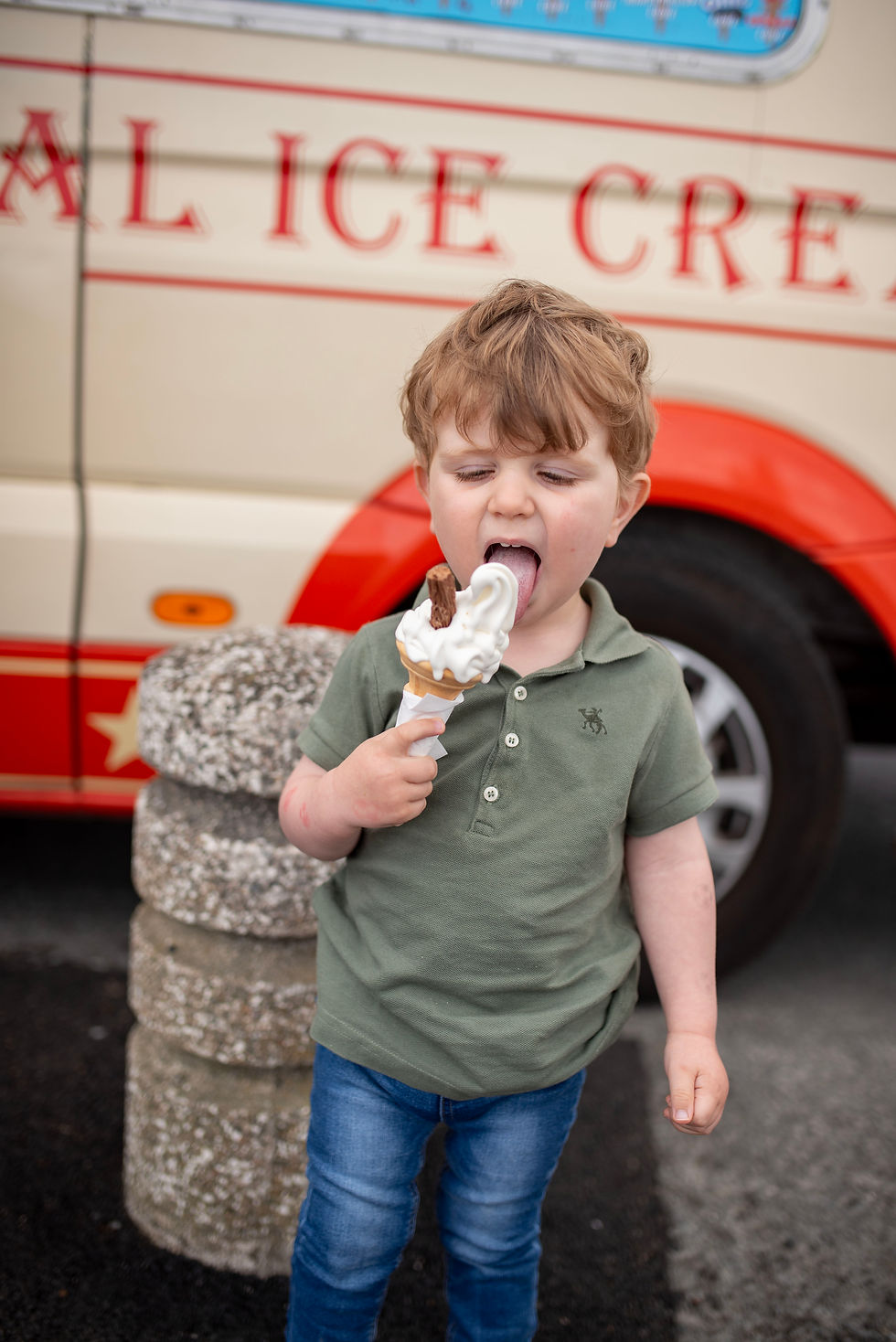 little boy eating ice cream with a flake