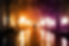couple walking arm in arm through dramatic street lights with lights that look like fireworks