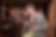 couple about to kiss in the entrance of a busy pub in Dublin