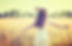 young woman in white dress running with arms outstretched through a sunlit meadow. for caroline mcelwee reiki treatmetns in blackrock, dublin. experienced usui reiki master teacher practitioner
