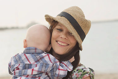 cara hodge with baby son wearing straw hat