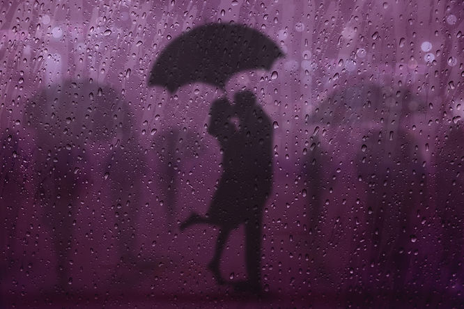 couple embracing in purple rain