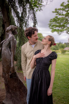 newly engaged couple mimicking a statue pose