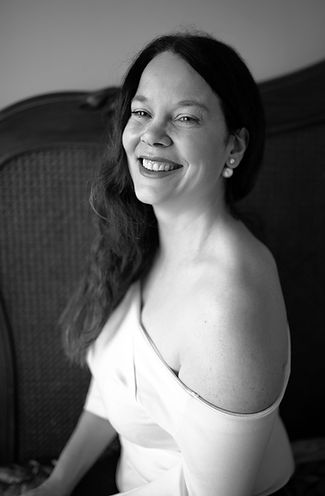 cara hodge laughing wearing a dark lipstick and white off the shoulder top. cara hodge of cara hodge photography dublin. photographing families, special events, birthdays, communion, christening, newborn, graduation, surprise proposals, maternity in a candid, unscripted way