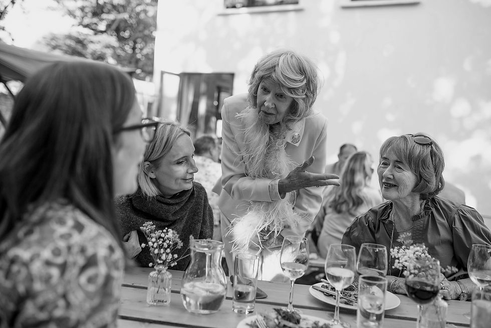 guests talking around a table laid in the garden