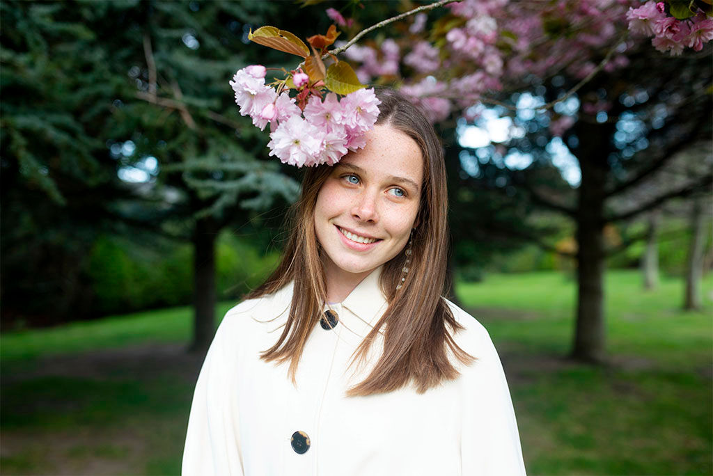 woman smiling under cherry blossom in blackrock, dublin