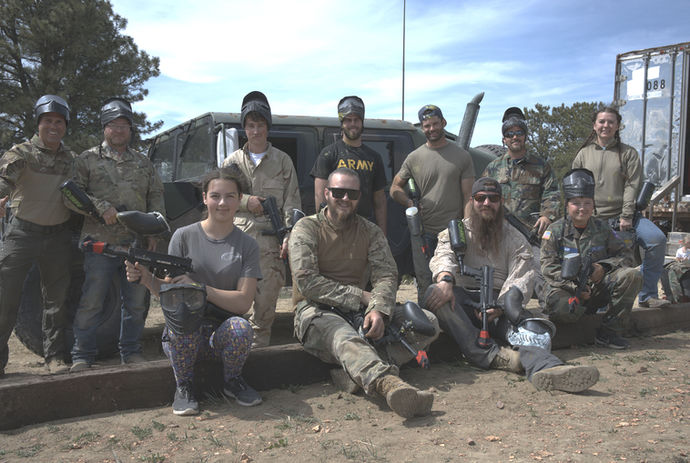 Group of paintball players next to a Humvee at Sheridan Tactical