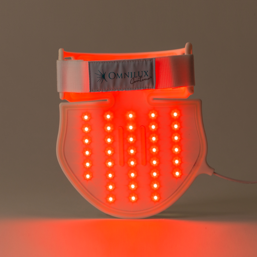 Thumbnail: Picture of Omnilux Neck and Decollete Light Therapy Device with lights on from the inside/back