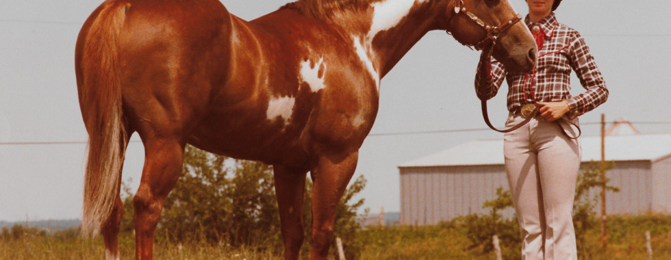 Becky Dixon with "Bear Cat" on their farm