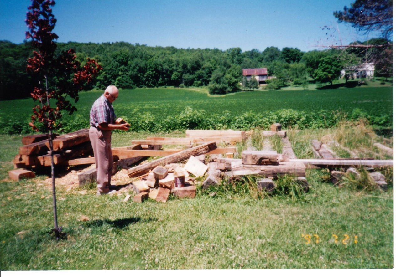 Maurice Blue sorting Zane Cabin logs