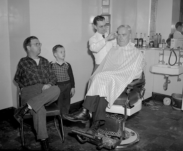 Getting a haircut at the Railroad YMCA on W. Columbus Ave. in Bellefontaine ca 1949