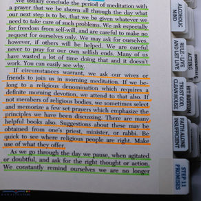 AA Big Book page with color-highlighted text and prayer tabs