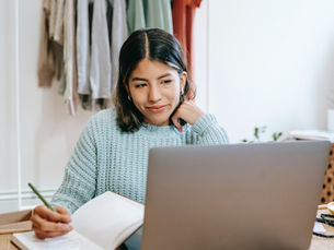 A woman working on a laptop