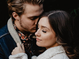 A couple intimately hugging