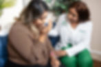 Therapeutic session between Jennifer Bradley and a female patient, showcasing holistic care.