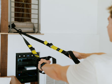a surfer using a TRX Suspension Trainer at Surf Ready Fitness