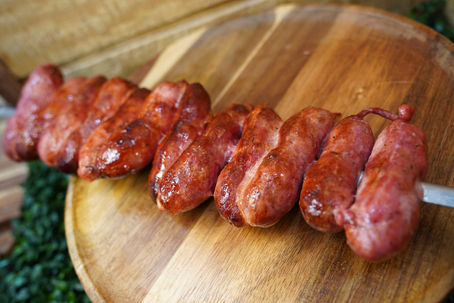Linguiça is a traditional Brazilian sausage made with seasoned pork, known for its rich flavor and juicy texture.  Unlike typical sausages, Brazilian linguiça is prepared with a unique blend of spices that give it a distinctive taste — slightly smoky, savory, and incredibly satisfying.  In Brazilian churrasco, it’s one of the most popular and recognizable items.