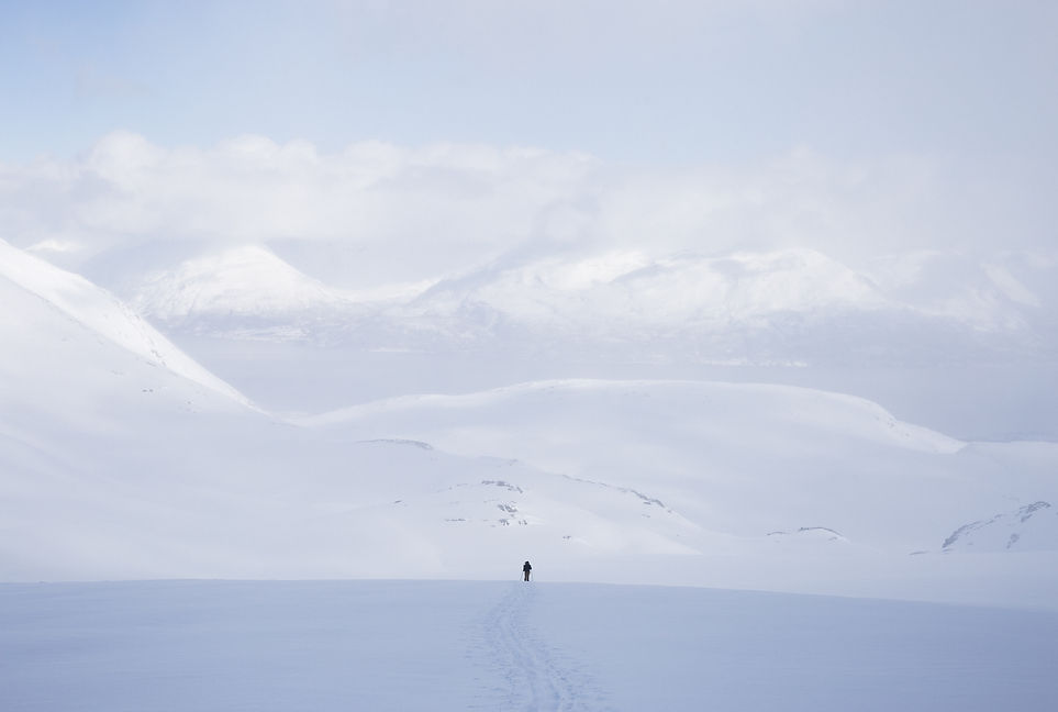 horizontal-shot-male-standing-snowy-area