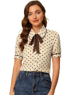 girl in beige polka blouse with neck tie
