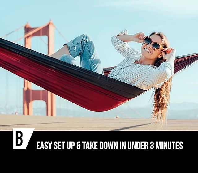 girl laying on hammock with bridge in background