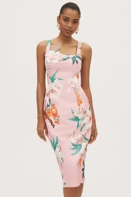 woman in sleeveless pink floral dress