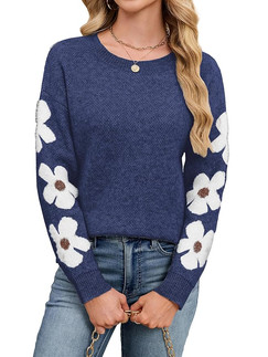 girl in blue sweater with flowers
