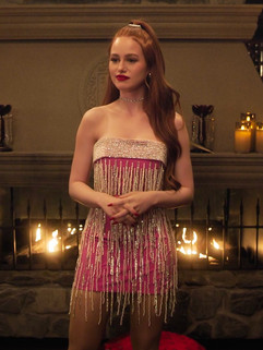 woman in front of fire wearing strapless dress