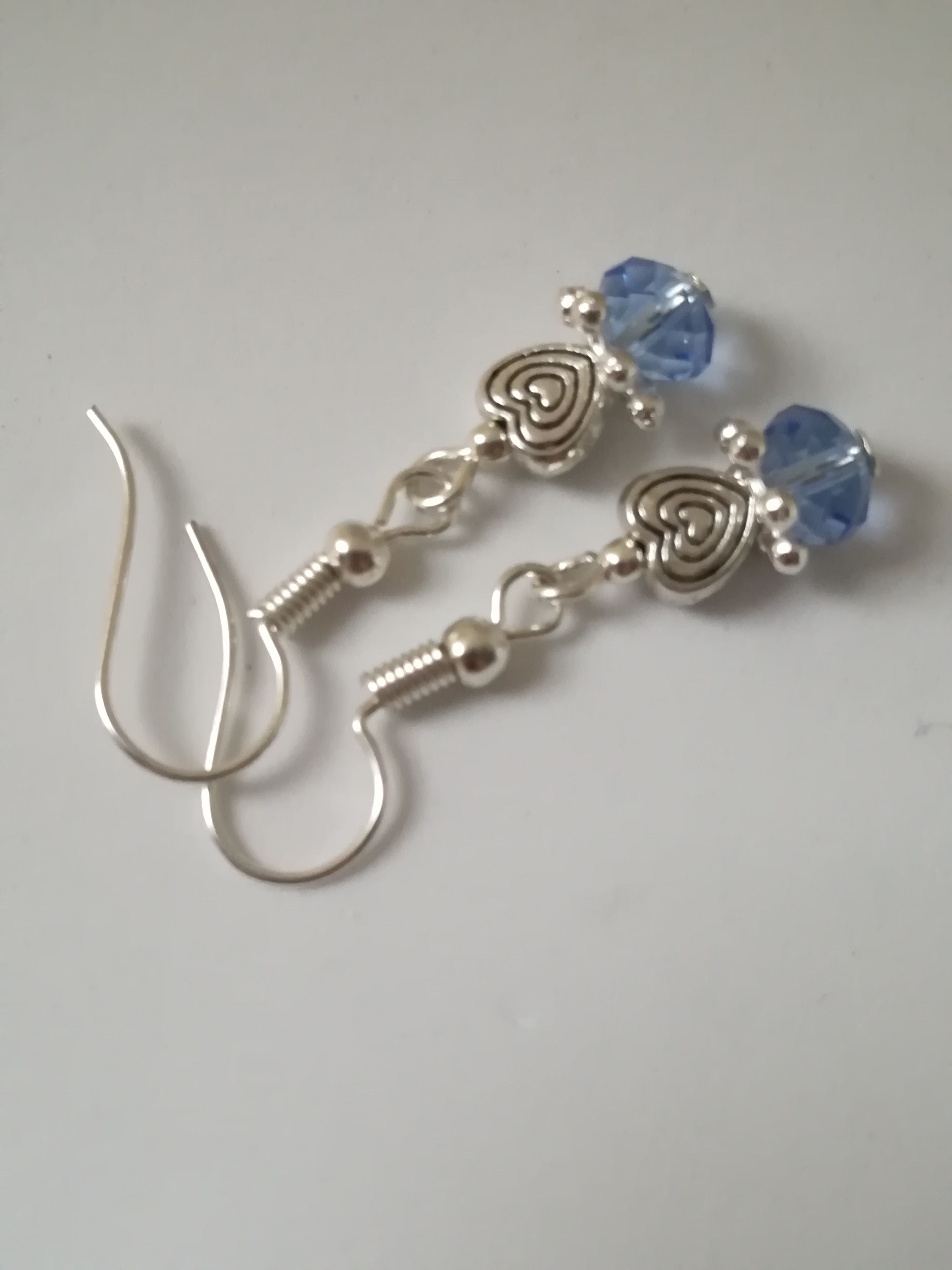 Blue crystals and silver tone hearts earrings