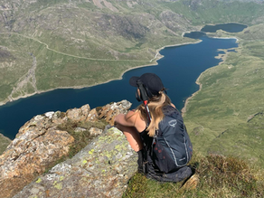 Ashley on mountain looking at view