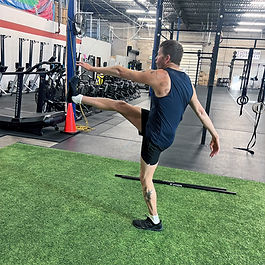 Wren Body Wellness client performing a warm up exercise of his corrective exercise training plan