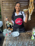 Mix Masters Bartender Hire Sydney holding cocktail and bottle