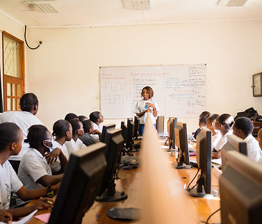 An African teacher mentoring some young students