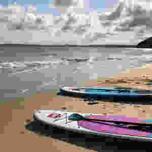 Stand up paddle boards on a beach